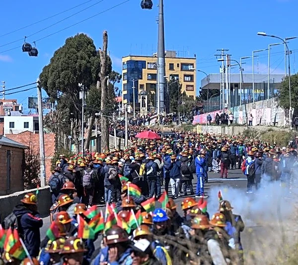 Bolivian miners clash with police in La Paz, demand president’s resignation