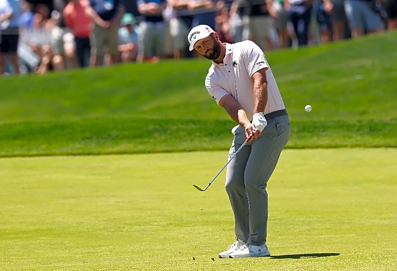 Golf-Rahm puts LIV spotlight aside after surging into PGA contention