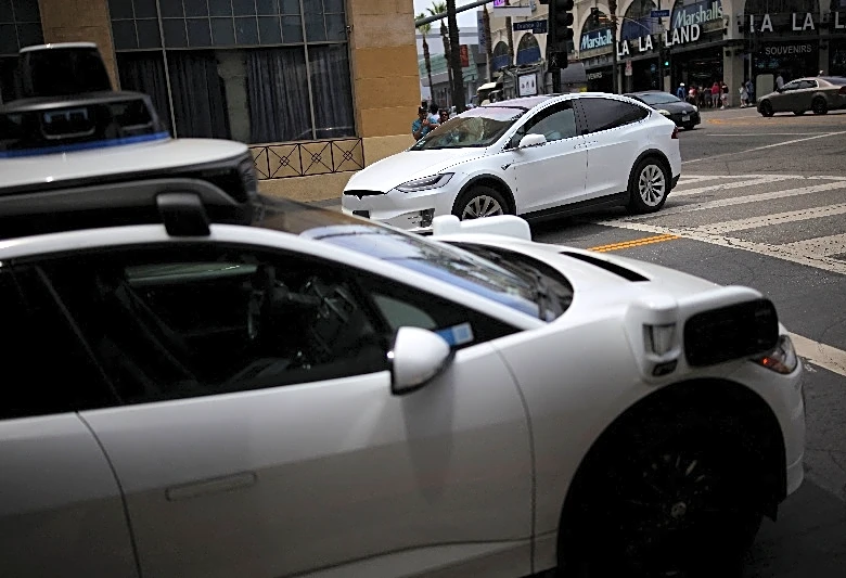 Tesla's Musk expects widespread use in US of cars without human monitors this year