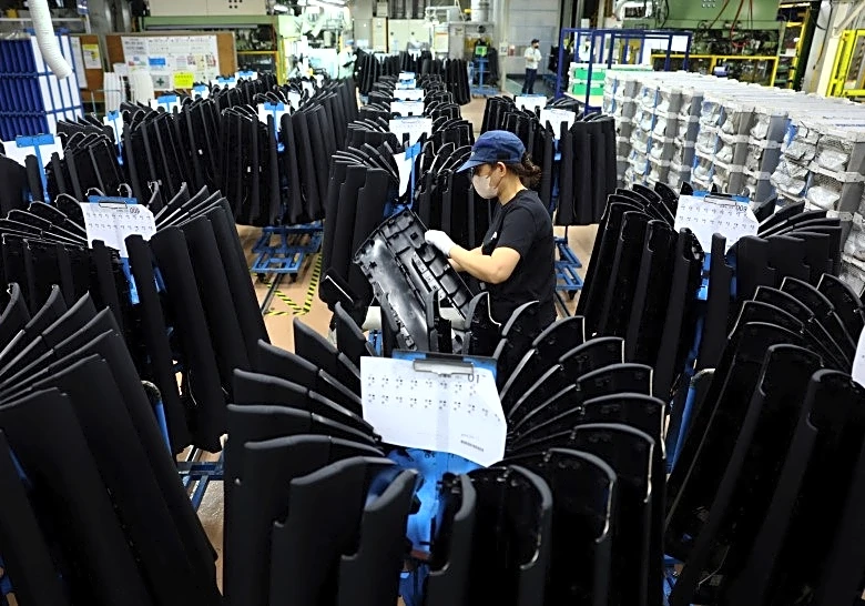 Japan manufacturers' mood edges up in May, services sector slips: Reuters poll