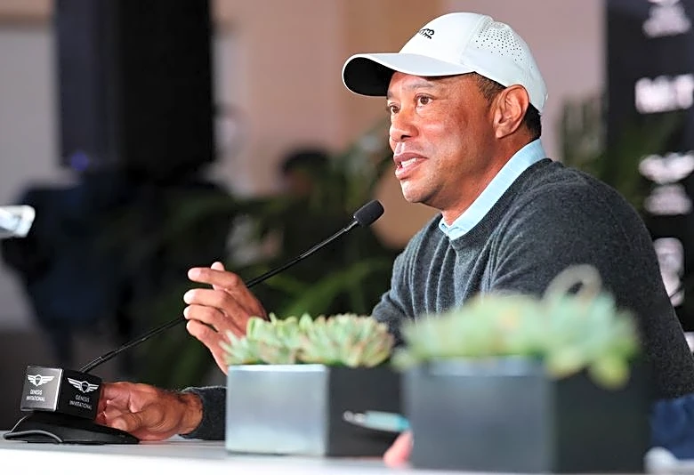 After brief stay in U.S., Tiger Woods jets back to Switzerland