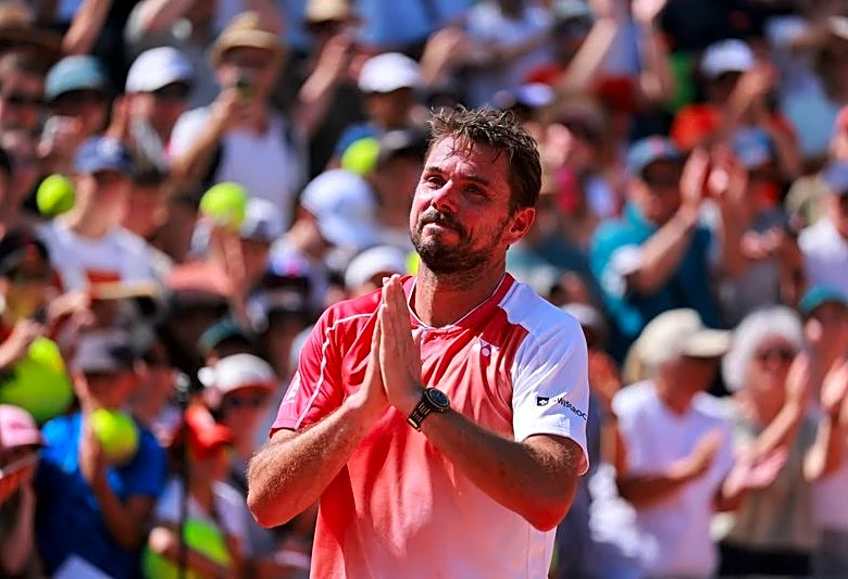 Tennis-Emotional Wawrinka bows out of final French Open with loss to De Jong