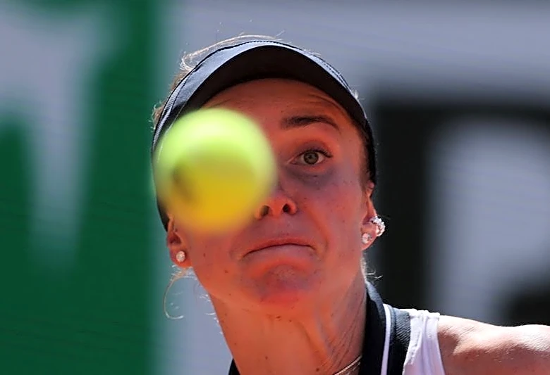 Tennis-Svitolina huffs and puffs into French Open round two
