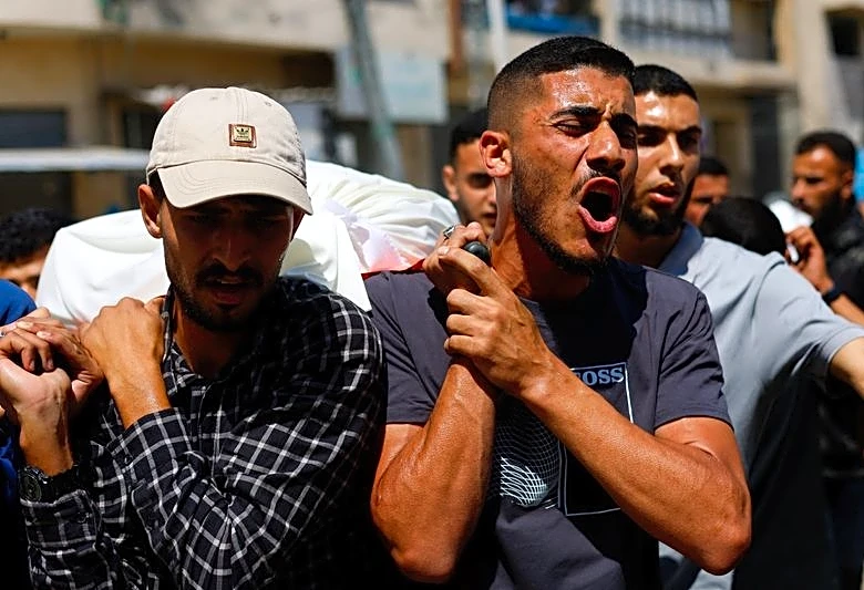 Palestinians mourn slain Hamas militant chief as Israel escalates Gaza attacks