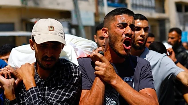 Palestinians mourn slain Hamas militant chief as Israel escalates Gaza attacks