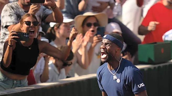 Tennis-Tiafoe makes online plea after losing racket in crowd during victory celebrations