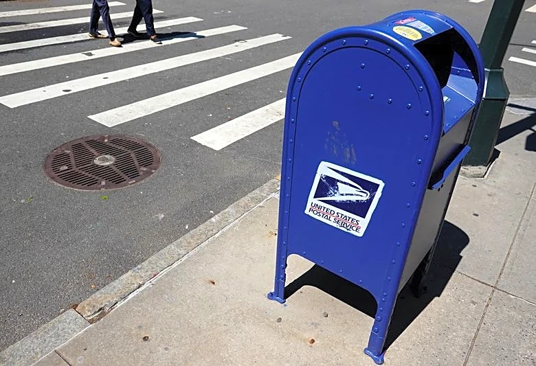 US Postal Service halts non-essential spending as cash crisis deepens