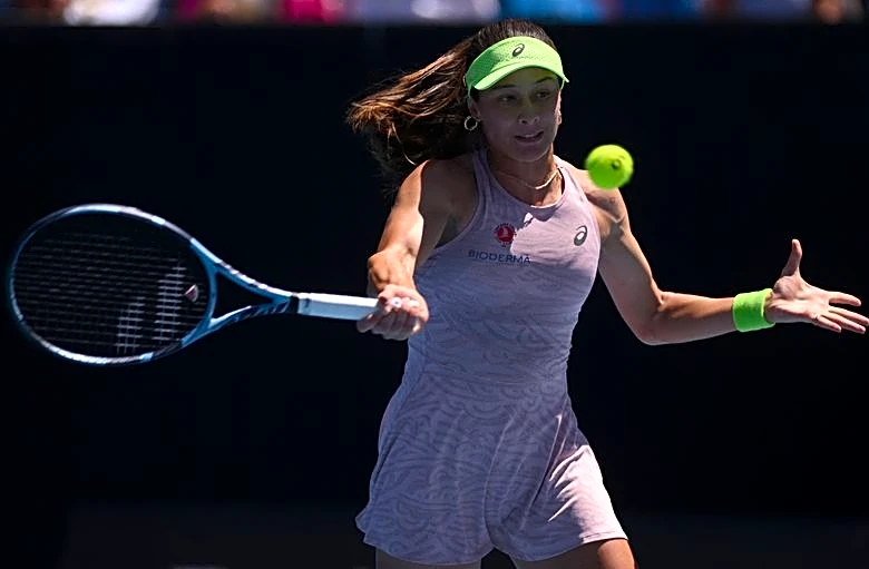Tennis-Sonmez trips over advertisement sign, tumbles out of French Open