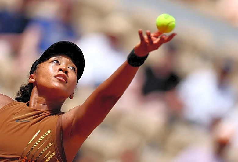Tennis-Gold-sequined Osaka survives three-set scare against teenager Jovic
