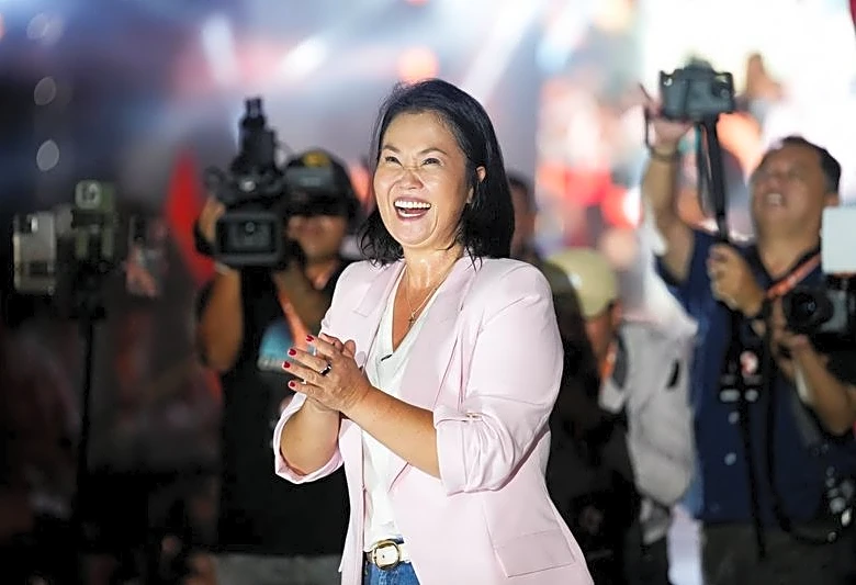 Right-wing Fujimori holds narrow lead one week before Peru presidential runoff, polls show
