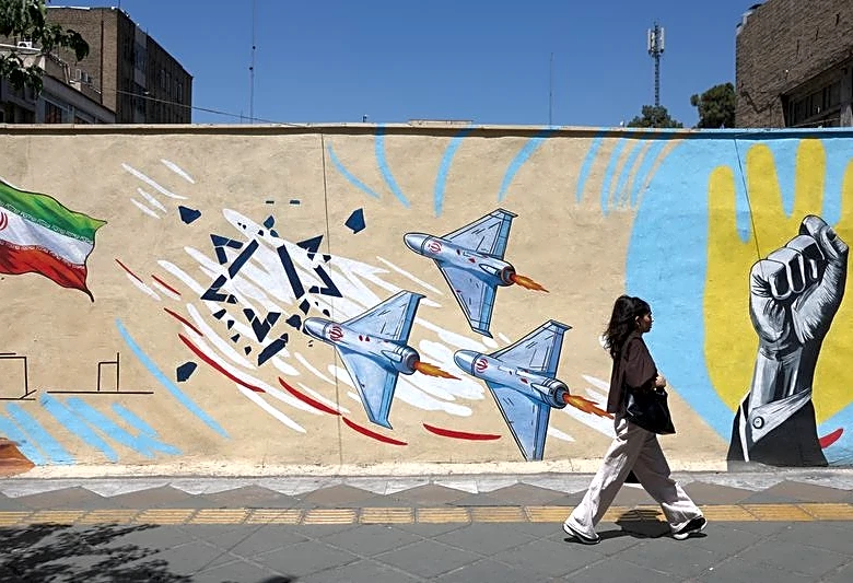 US says it struck Iranian military sites, Tehran responds with air base attack