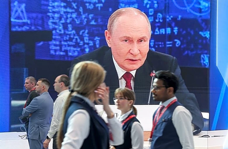 Putin faces rival visions of war and peace at Russia's 'Davos'
