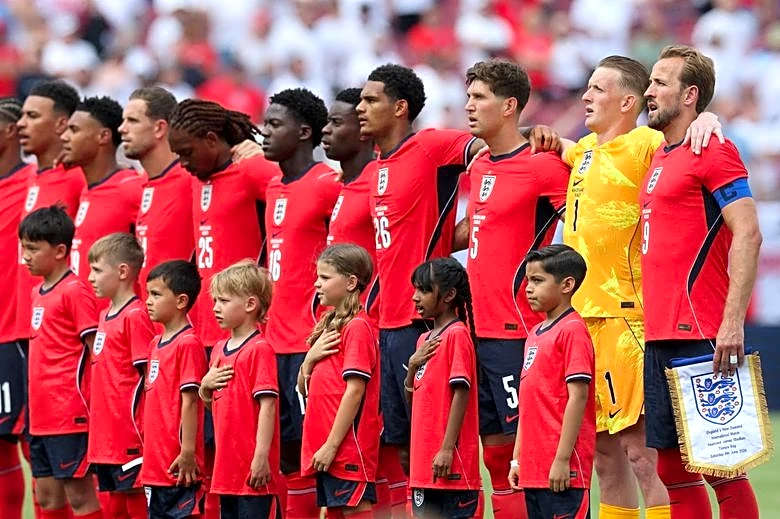 Soccer-England labour to win over New Zealand as Germany defeat USA
