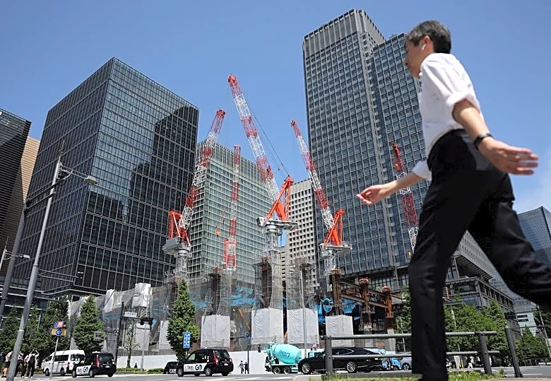 Japan's economy cools on weak capex in Q1, revised data shows