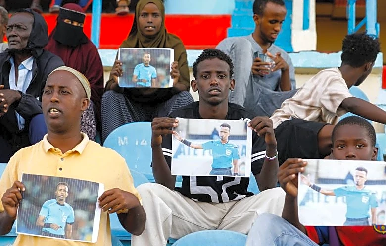 Soccer-Somali soccer referee on his way back home after being denied entry into United States