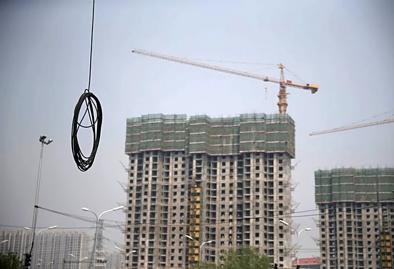 China's new loans miss forecasts in May as property slump curbs demand