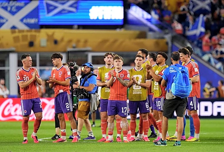 Soccer-Scotland hope to break tournament jinx with lucky 13 after win over Haiti