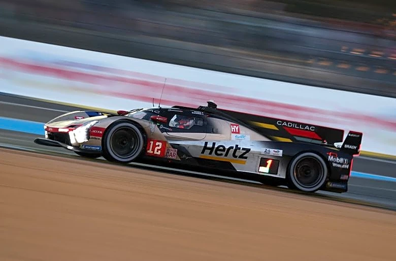 Motor racing-Cadillac and BMW in tight battle with six hours to go at Le Mans