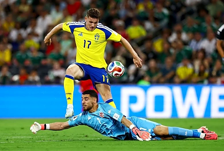 Soccer-Elite Swedish strike force delivers Tunisian defence a reality check