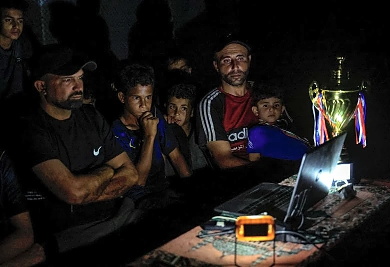 Gazans displaced by war watch World Cup from the ruins
