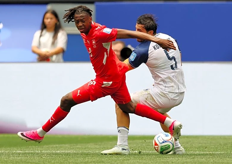 Soccer-Swiss wonderkid Manzambi dazzles in World Cup win