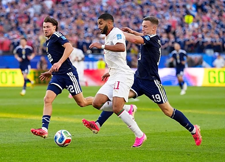 Soccer-Morocco bully Scotland into submission for 1-0 win, take control of Group C
