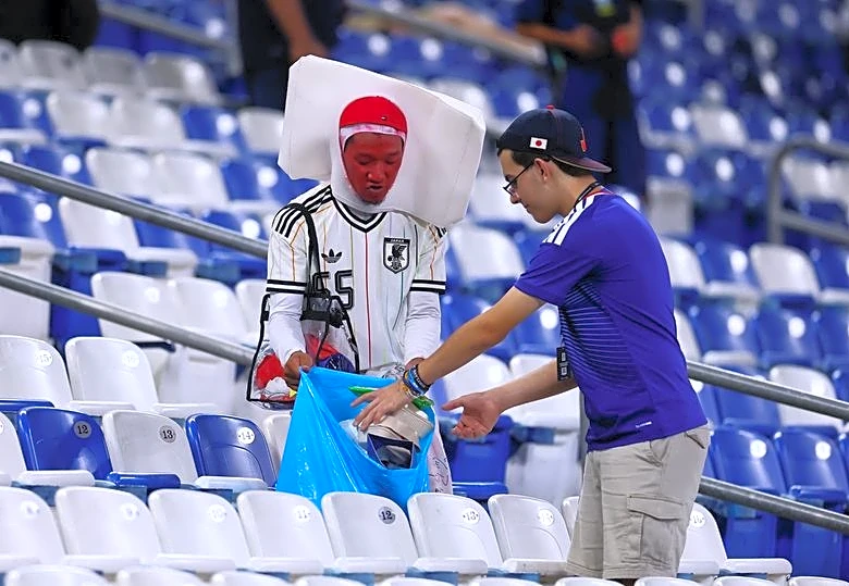 Soccer-After Samurai Blue sweep aside Tunisia, Japan fans clean up Monterrey stadium