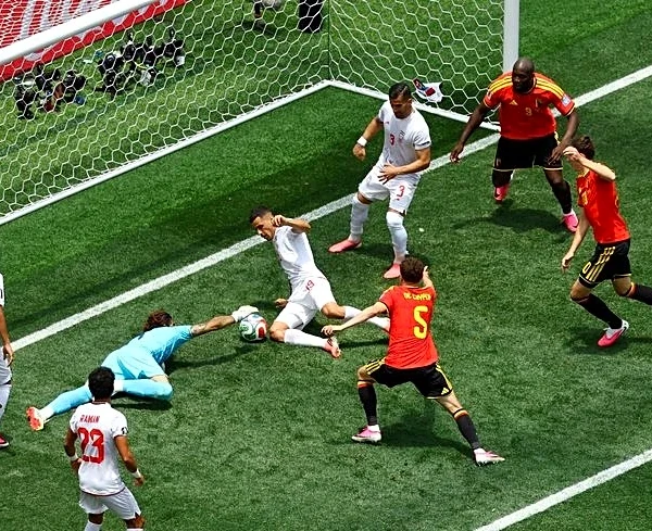 Soccer-Beiranvand heroics help Iran hold 10-man Belgium to goalless draw
