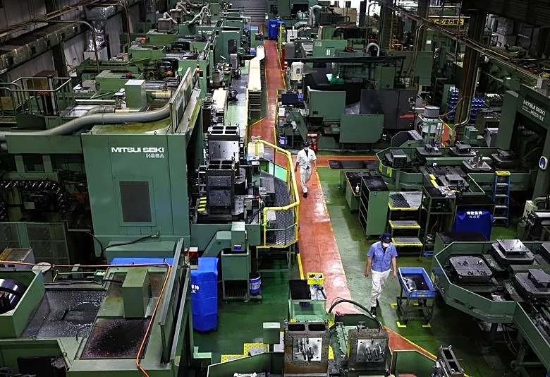 Japan's factory activity expands at faster pace in June as new orders surge