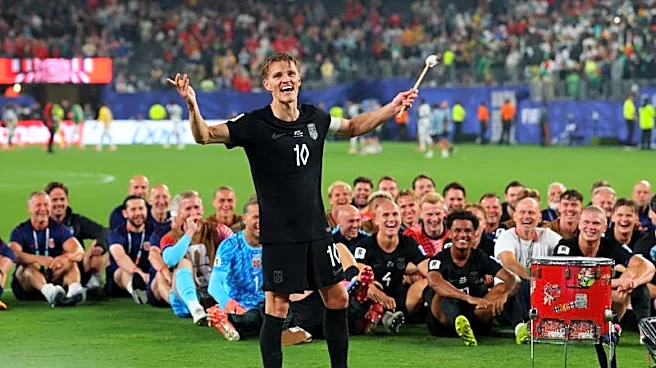 Soccer-Ecstatic Norway squad celebrate World Cup progress with Viking row