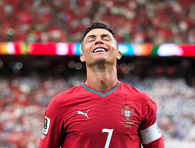 Soccer-'I'm back': Record-breaker Ronaldo fires Portugal to 5-0 win over Uzbekistan