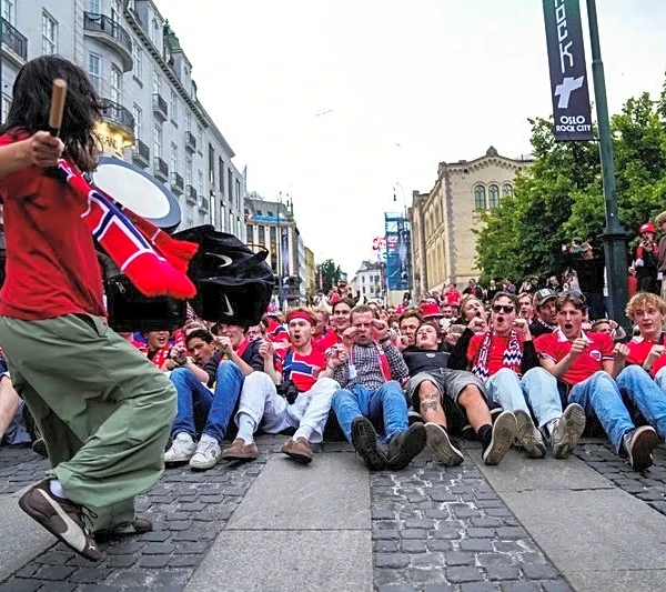 Soccer-No regrets for no-row Norway fan caught sitting still on TV