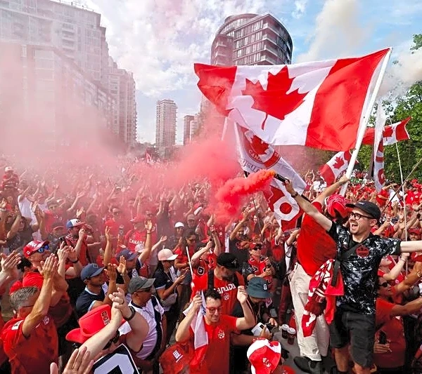 Soccer-Canada fans on the march turn Vancouver into sea of red and white