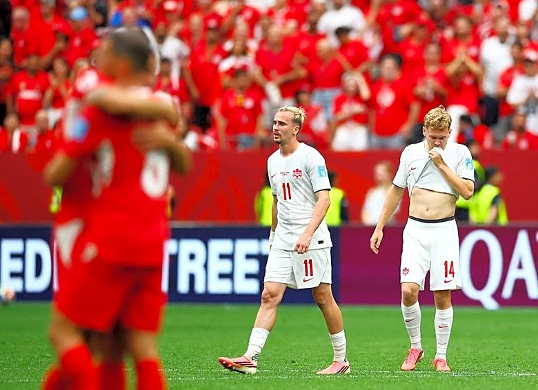 Soccer-Canada suffer rude awakening as Swiss claim Group B top spot