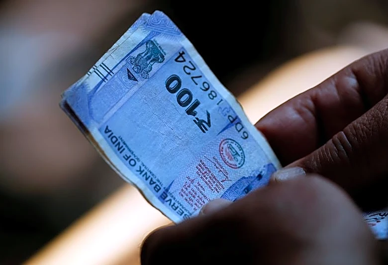 Bears loosen grip on rupiah, rupee on lower oil prices, policy support: Reuters poll