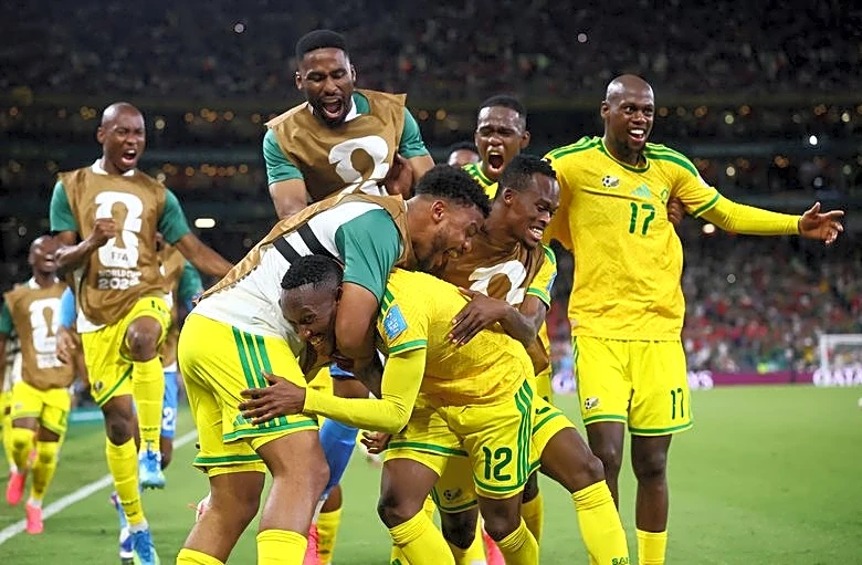 Soccer-Fuelled by anger, South Africa take surprise place in World Cup last 32