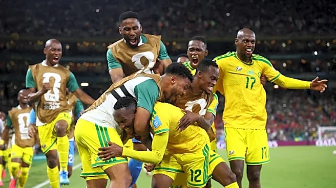 Soccer-Fuelled by anger, South Africa take surprise place in World Cup last 32