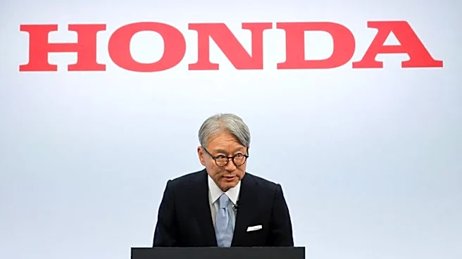 Honda CEO apologises for company's loss, wins investor backing at annual meeting