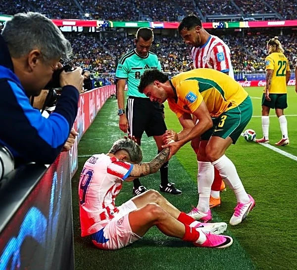Soccer-Paraguay coach concerned after player clatters into pitch-side advertising boards