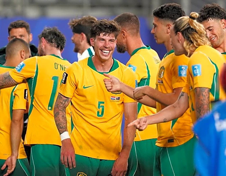 Soccer-Australia's Bos leads 'Baby-roos' push into World Cup knockouts