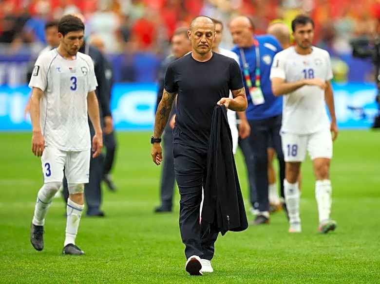 Soccer-Cannavaro shields Uzbekistan from pressure before targeted Congo clash
