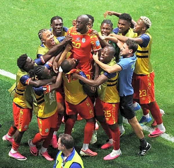 Soccer-DR Congo seal place in World Cup knockouts with comeback win over Uzbekistan
