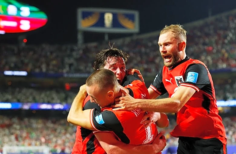Soccer-Austria and Algeria advance to World Cup round of 32, Iran eliminated