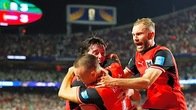 Soccer-Austria and Algeria advance to World Cup round of 32, Iran eliminated