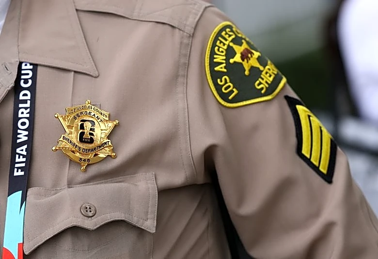 Soccer-Police, firefighters proudly wear World Cup badges as they provide security