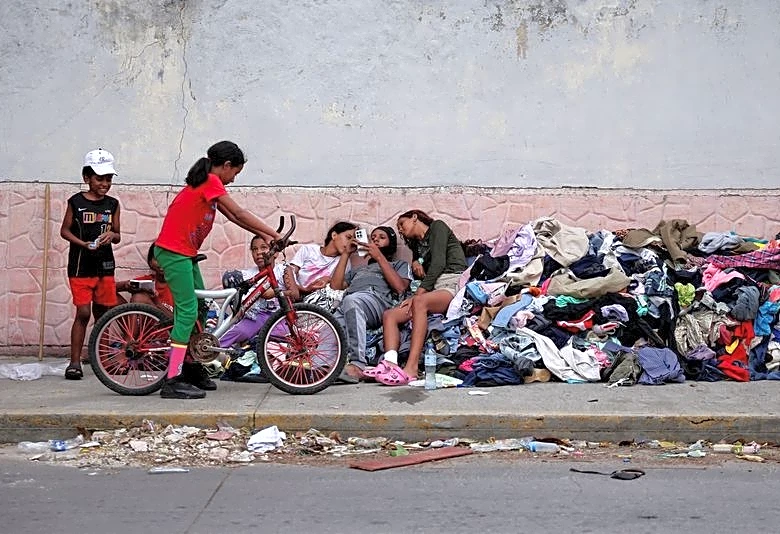 Families of Venezuelans deported from the US and lost in hotel collapse search for loved ones, and for answers