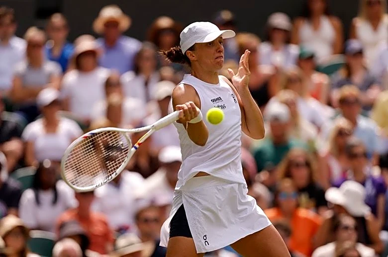 Tennis-Defending champion Swiatek struggles to emotional first-round victory