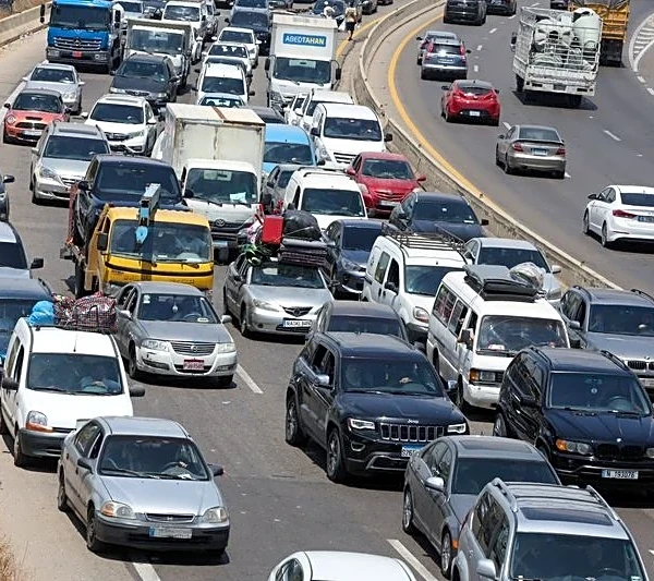 Hundreds of thousands of Lebanese head home as fighting eases, many still stranded