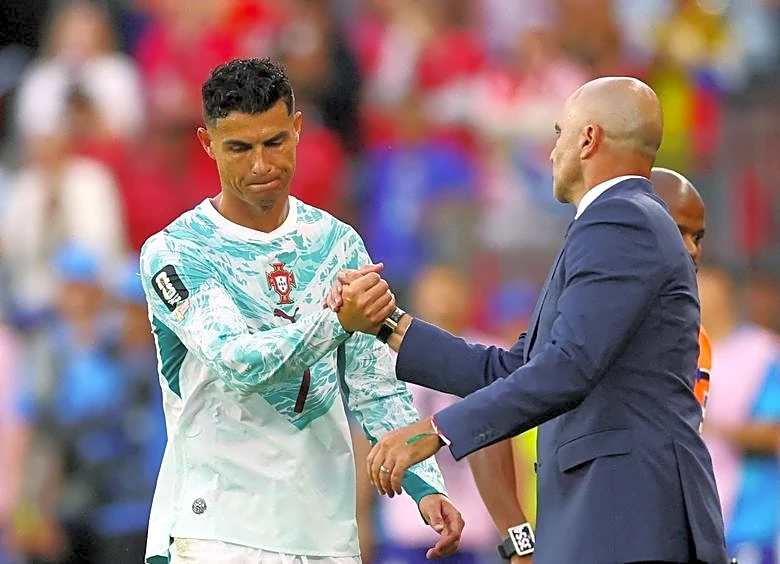 Soccer-Portugal's Martinez takes off Ronaldo when push comes to shove