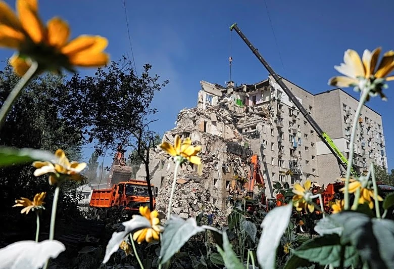 Ukrainian rescuers clear rubble as Kyiv mourns 30 killed in Russian attack
